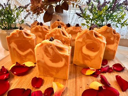 Hand-cut LUMÉA Sandalwood soap bars on a wooden board with rose petals in natural daylight – artisan cold process soap, approx. 130g (125–135g).