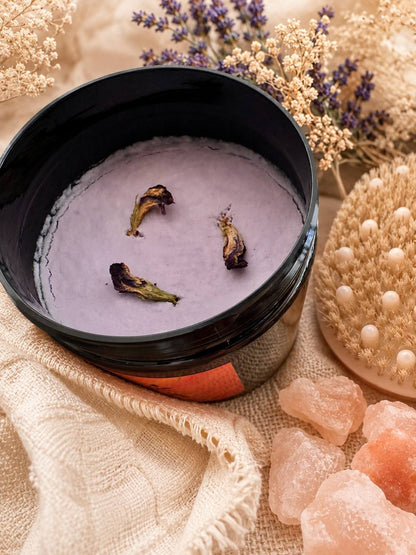 LUMÉA natural handmade body scrub with exfoliating nature oils texture, dried flowers, Himalayan salt crystals and spa body brush in boho setting